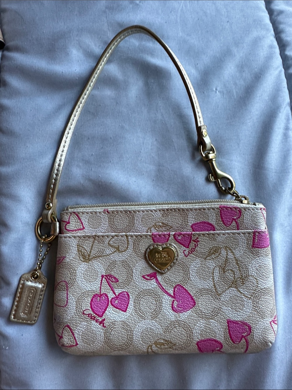 Coach Cream Wristlet with Pink Heart Print and Gold Accents